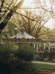 carousel in the park at golden hour © by Natallia