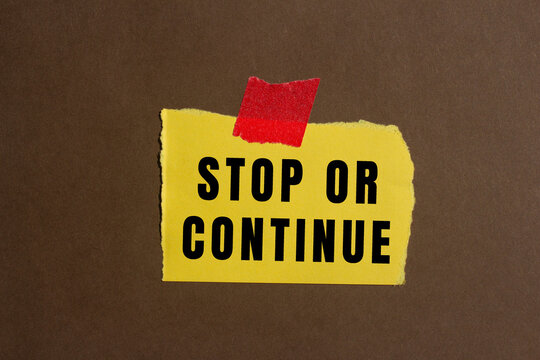 Stop or Continue text concept photo