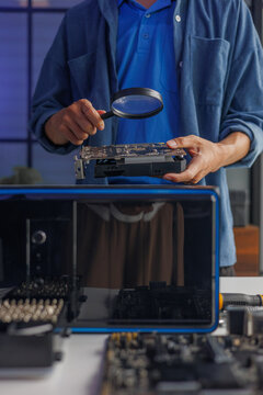 A computer technician repairing or assembling a desktop computer.