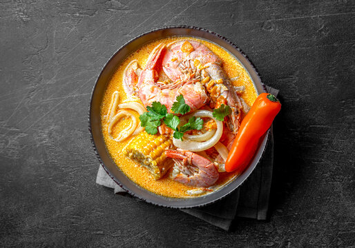 Peruvian seafood soup Chupe de Camarones. Seafood stew with shrimps and corn