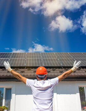 Installing solar panels on a house roof. Selective focus.