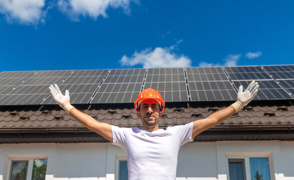 Installing solar panels on a house roof. Selective focus.