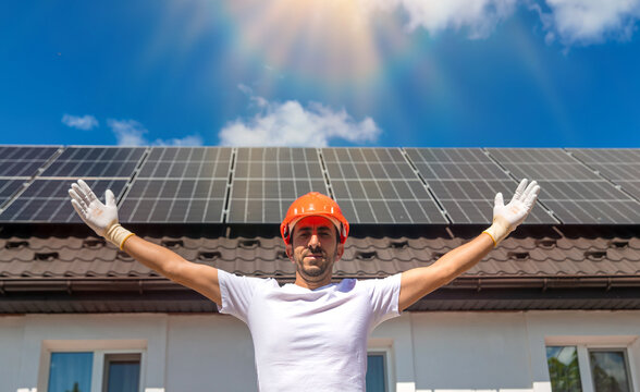 Installing solar panels on a house roof. Selective focus.