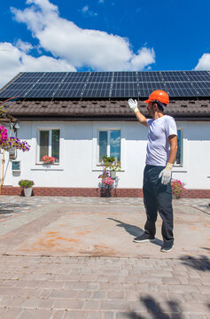 Installing solar panels on a house roof. Selective focus.