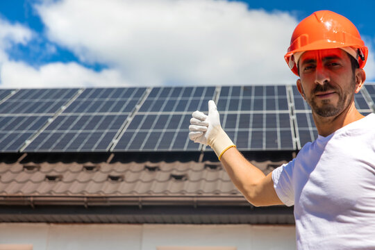 Installing solar panels on a house roof. Selective focus.