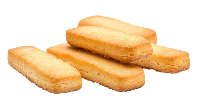 A small pile of golden brown baked shortbread biscuit sticks stacked together isolated on a solid black background, for food