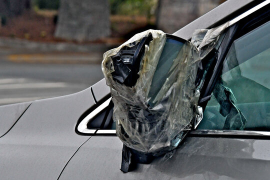A temporary car repair using tape is often called, a hack, MacGyver fix, temporary fix, kludged, or Redneck engineering