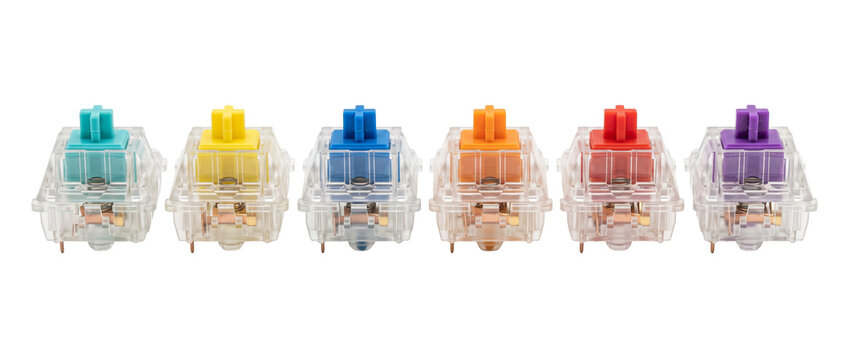 Mechanical keyboard switches colorful set lined up on black background for custom PC gaming setup and hardware customization, featuring transparent housing and multi-colored tactile stems. Tech design