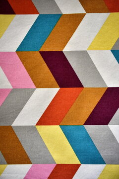 Vertical view of colorful chevron fabric pattern texture background with geometric design