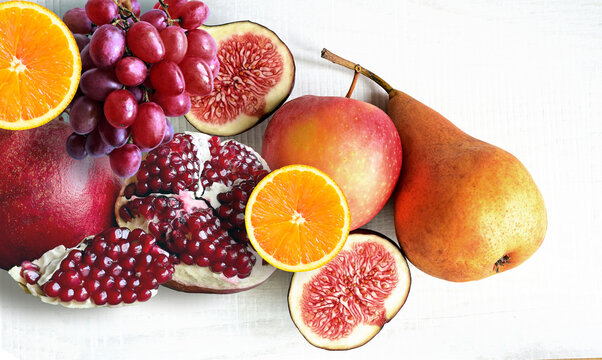 Fresh fruits mixed. Tasty fruits background, citruses, apples, grapes.