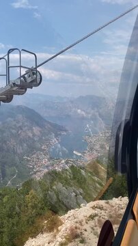 High-angle view of Bay of Kotor and mountains in Montenegro from moving cable car