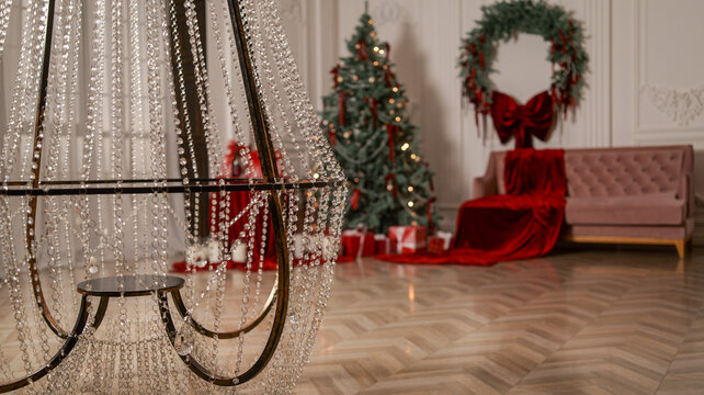 Elegant Christmas scene with a crystal chandelier and festive decorations