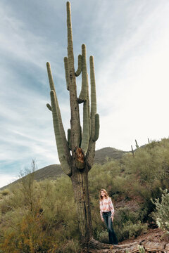 Teen Girl Standing by Saguaro Cactus