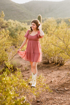 Young Woman Walking in the Desert