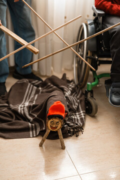 Family celebrating catalan tio de nadal with child in wheelchair
