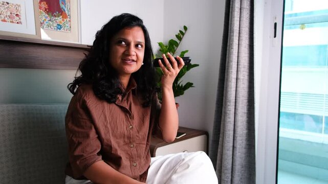 Woman learning new language using online translator on smartphone at home, language learning, translation app, self study and digital education concept