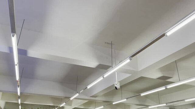 Modern office ceiling lights with security CCTV camera