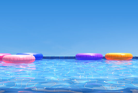 Colorful swimming rings in blue swimming pool. Pool party, summer background.  