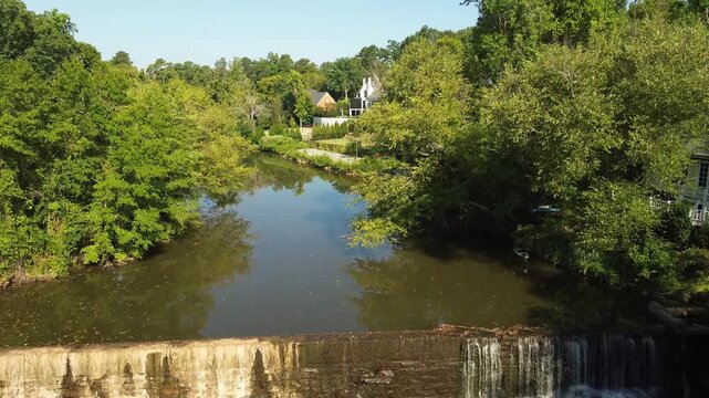 Aerial view of Lassiter Mill Park waterfall and Crabtree Creek along the Raleigh greenway trail