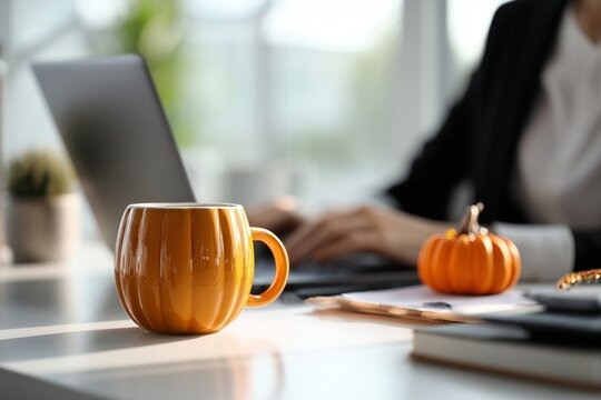 Cozy Autumn Workday with Pumpkin Mug and Laptop