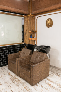 Hair washing station in modern barbershop interior