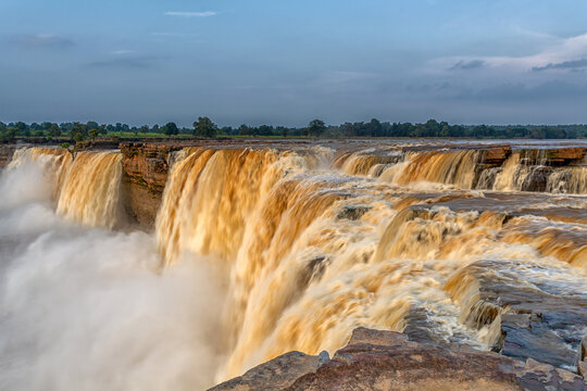 A close view from the top of the beautiful Chitrakote Waterfall located in the Indian state of Chhattisgarh on the Indravati River during post monsoon season, a long exposure photography of nature