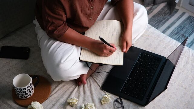 Woman brainstorming creative ideas at home, writing thoughts in journal and planning new concepts, ideation, creativity, productivity and business planning concept
