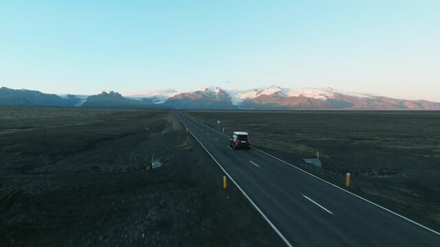 Road Trip Aerial With Car and Snow-Capped Peaks, Iceland