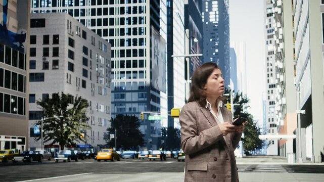 Joyous businesswoman uses a smartphone on a city street while checking messages; she stands on a metropolitan boulevard and scrolls the phone touchscreen.