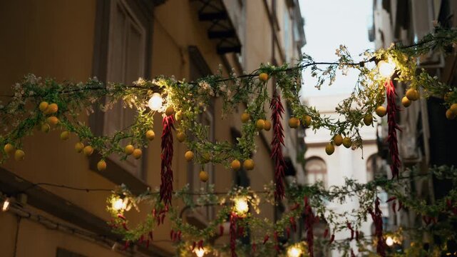 Lemon decorations and lighting amidst the buildings and streets of Naples
