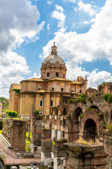 Fototapeta premium Ancient ruins of the Roman Forum and the church of Santi Luca e Martina in Rome Italy