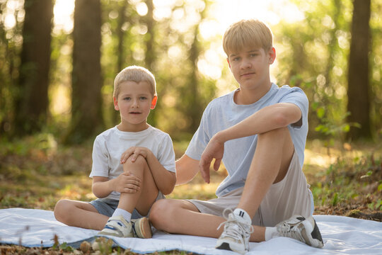  two happy brothers sitting together. 