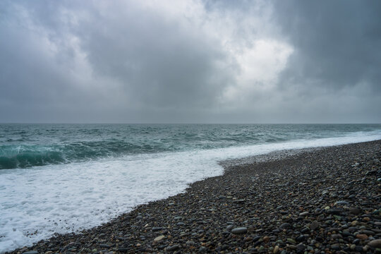 A gloomy summer seashore. Summer sea view.