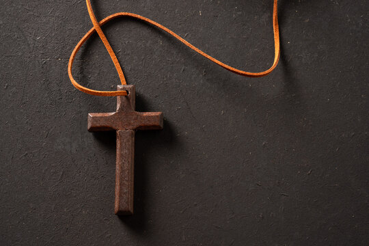 Wooden cross on a black background