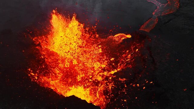 Active lava fountain erupting from volcanic vent with glowing molten flow over dark scoria rim, drifting ash, heat haze, and rugged barren terrain, with lava, eruption, volcano, magma detail