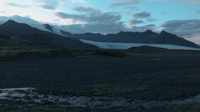 Fast Aerial Pass Over Glacier at Dusk, Iceland