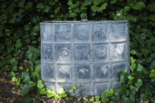 Old lead container dating from 1670, presumably for compost, Chelsea Physic Garden, historic botanical garden, oldest botanical garden in London, founded in 1673 by the Worshipful Society of Apothecaries, Chelsea, England, Great Britain