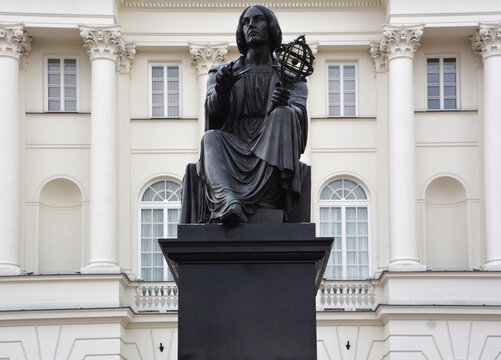 WARSAW POLAND: Nicolaus Copernicus Monument is one of the Polish capital's notable landmarks stands at Staszic Palace the seat of the Polish Academy of Sciences by Bertel Thorvaldsen in 1822