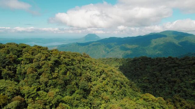 Aerial view of lush Monteverde rainforest and Arenal volcano in Costa Rica