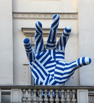 Giant blue hand sculpture on Collegium Nobilium was an elite boarding secondary school for sons of magnates and wealthy gentry, founded in 1740 in Warsaw by Stanislaw Konarski 