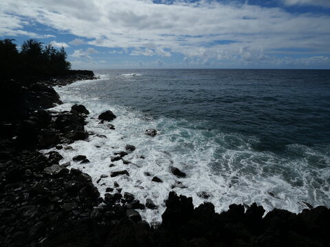 Rough Ocean Waves Along the Black Volcanic Coast of Hawaii Island