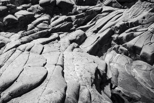 Black and White Volcanic Rock Formation with Cracks and Natural Texture