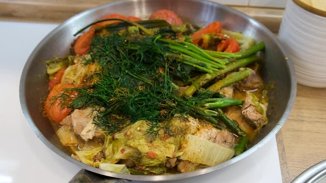A dish of stewed vegetables in a frying pan. Selective focus.