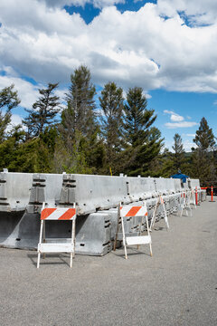 Summer construction season work zone, concrete Jersey Barriers and traffic barriers in road pullout parking lot staging area, Yellowstone National Park
