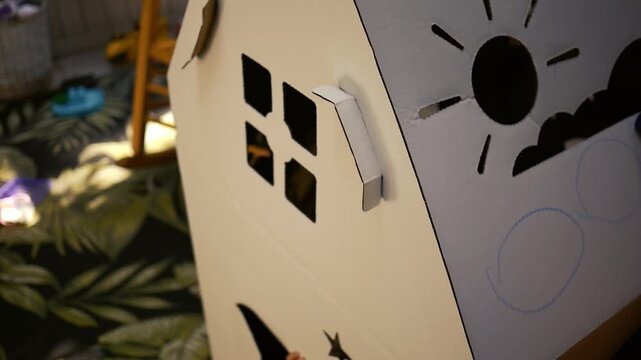 Nostalgia Playhouse Series - Child Draws on Cardboard Playhouse