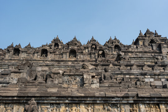 Borobudur temple complex featuring ancient buddha statues and stupas