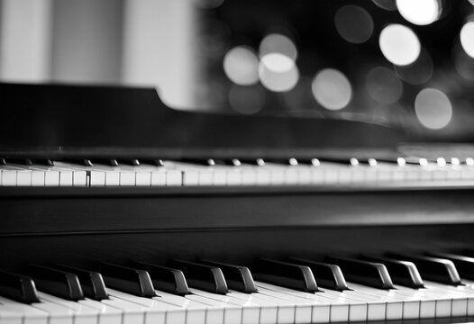 Close-up of piano keys with beautiful bokeh background, black and white