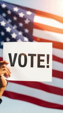 African American woman holding a sign with the word vote in front of the American flag representing democracy and election participation