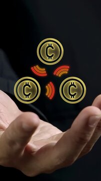 Businessman open hand vertical shot supporting glowing currency coins with contactless wifi signals. Peer to peer digital payment, wireless money transfer network, and fintech transaction concept.