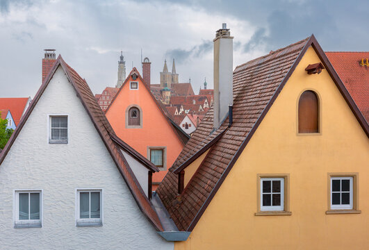 Traditional houses with steep tiled roofs overlooking the historic architecture of Rothenburg ob der Tauber, Germany.